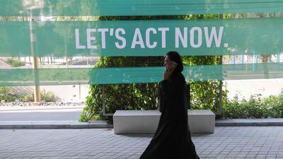 A delegate attends the Cop28 climate talks at Expo City in Dubai yesterday. Attendees have been talking about radically changing course on nearly three centuries of industrialisation. AFP