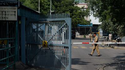 An Indian security guard stands near a barricade at New Delhi’s international airport in New Delhi after officials suspected a consignment containing radioactive material had leaked. Sajjad Hussain / AFP