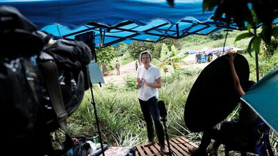 A journalist reports near the Tham Luang cave complex. Reuters