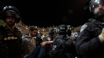 Israeli police detain Palestinian men during the clashes. AP
