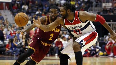 Kyrie Irving had a game-high 41 points as he wore a protective mask to cover his broken nose. Alex Brandon / AP
