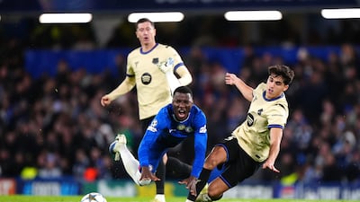 Chelsea's Moises Caicedo, left, is challenged by Barcelona's Pau Cubarsi. AP
