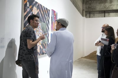 People admire a painting at the opening of 21,39. Willy Lowry / The National