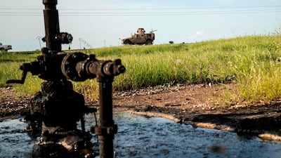 A US military vehicle patrols the oil fields in the town of Qahtaniyah in Syria's northeastern Hasakeh province near the Turkish border, on May 8. Delil Souleiman / AFP