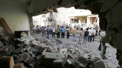 Residents gather at the site of a bomb attack in Kirkuk, 250km north of Baghdad.