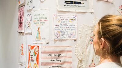 A visitor at the The Tiny Pricks Project exhibition in New York's Lingua Franca. Yvonne Tnt / Courtesy Tiny Pricks Project