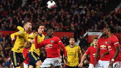 Arsenal's English defender Calum Chambers (L), Arsenal's Brazilian defender David Luiz (2nd L) Manchester United's defender Axel Tuanzebe (C) watch the ball during the English Premier League football match between Manchester United and Arsenal at Old Trafford in Manchester, north west England, on September 30, 2019. AFP / Paul ELLIS