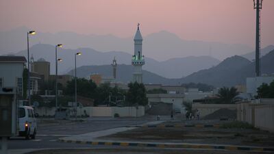 The sun sets over the main mosque in the Faseel neighbourhood of Fujairah. Amy Leang / The National