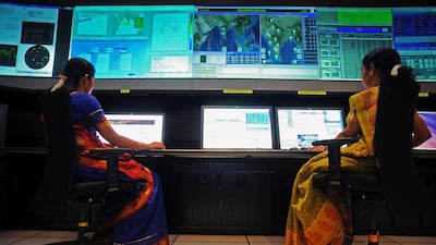 Scientists from the Indian Space Research Organisation (ISRO) work in the Indian Regional Navigational Satellite System (IRNSS) control room at the Indian Deep Space Network (IDSN), a network of large antennas and communication facilities that support India's interplanetary spacecraft missions, located at Byalalu village about 50 kms from Bangalore. Manjunath Kiran / AFP
