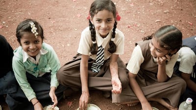 Children enjoying their midday meals provided jointly by the Akshaya Patra Foundation and the Indian government. For a lot of poor children in India, this is their only meal for the day. Photo courtesy the Akshaya Patra Foundation