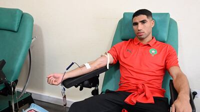 The Morocco football team's star defender Achraf Hakimi donates blood at a clinic in Agadir. AFP