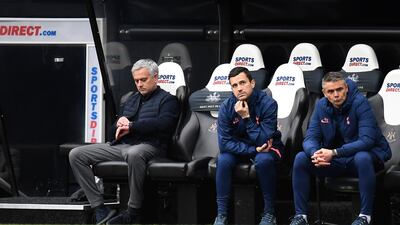 Tottenham manager Jose Mourinho checks his watch. Getty Images