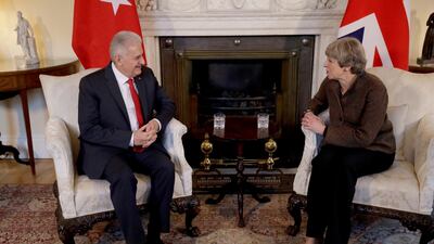 British Prime Minister Theresa May speaking to Turkey's Prime Minister Binali Yildirim, left. Matt Dunham/ AP Photo