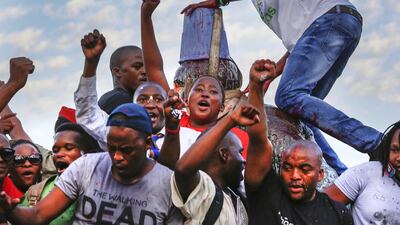 A statue of Cecil John Rhodes is removed from the University of Cape Town as thousands cheer in April 2015. Nic Bothma / EPA