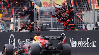 Red Bull mechanics celebrate Verstappen's win. Reuters