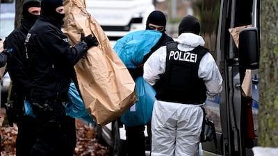 Police in Berlin during a raid against suspected terrorist plotters. EPA