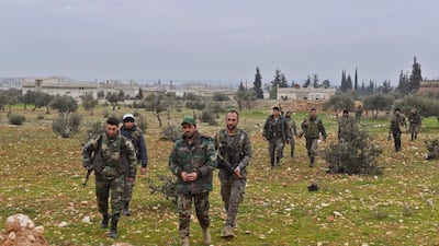 Syrian army soldiers advance in Tall Touqan village, in Syria's northwestern Idlib province, about 45 kilometres southwest of Aleppo. AFP