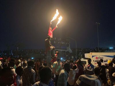 A protester makes flares from aerosol cans at the sit-in outside the Sudanese army headquarters in Khartoum. Hamza Hendawi for The National