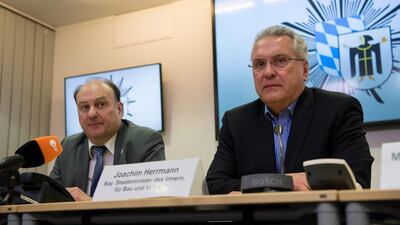 Bavarian state interior minister Joachim Herrmann, right, and Munich police chief Hubertus Andrae, left hold a press conference in Munich. Sven Hoppe / EPA