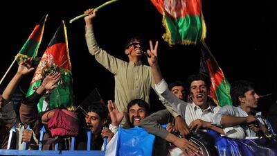 Afghan cricket fans welcome home the national team in Kabul on Saturday after they qualified for the 2015 Cricket World Cup. Noorullah Shirzada / AFP
