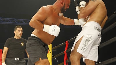 Fatih Ulusoy, left, is open to furthering his movie career, but the Turk’s primary focus is on fighting. Jeffrey E Biteng / The National