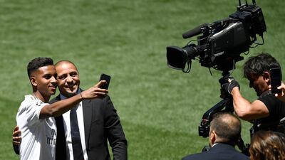 Rodrygo takes a selfie photo with Roberto Carlos during his official presentation at Real Madrid. AFP