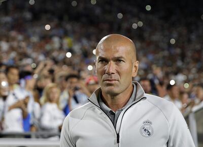 Real Madrid manager Zinedine Zidane walks across the field. Jae C Hong / AP Photo