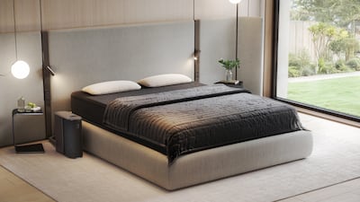 The Eight Sleep Pod 5 Ultra system shown with its control unit, mattress, and integrated Active Grid blanket, set within a modern, minimalist bedroom.