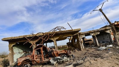 Destroyed houses and vehicles in the village of Sousa, near the village of Baghouz in the eastern Syrian province of Deir Ezzor. AFP