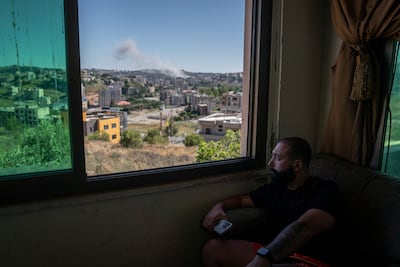 A paramedic looks out at the scene of an Israeli Army air strike in Nabatieh. Getty Images