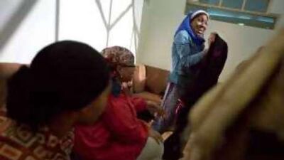 Khadijah Rashid (centre) shows off her new abaya during a class break at the Zayed House for Islamic Culture.