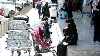Saudi passengers are seen outside the Saudi Arabia's Abha airport. Reuters