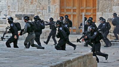 Israeli security forces inside Jerusalem's Al Aqsa Mosque complex following clashes with Palestinian protesters on April 22. AFP