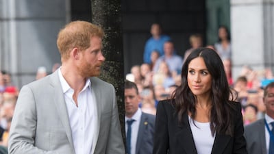 In Dublin, Meghan wore a bespoke Givenchy black trouser suit teamed with a white scoop neck T-shirt and killer heels. Getty Images
