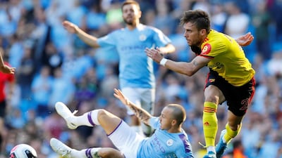 Watford's Kiko Femenia in action with Manchester City's Angelino. Reuters