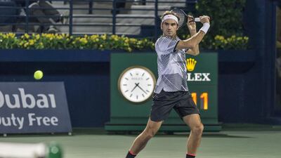 Roger Federer in action against Benoit Paire at the Dubai Duty Free Tennis Championships. Antonie Robertson/The National