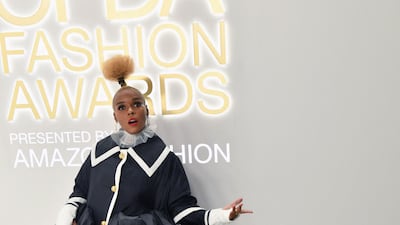 Janelle Monae wore an opera coat by Thom Browne, with building block heels and a bag shaped like a toy dog.