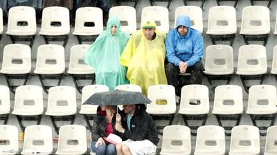 People wait in the stands of Court Suzanne Legnlen as rain interupts Alize Cornet of France against Venus Williams of the USA during their women’s single third round match at the French Open tennis tournament at Roland Garros in Paris, France, 28 May 2016. EPA/IAN LANGSDON