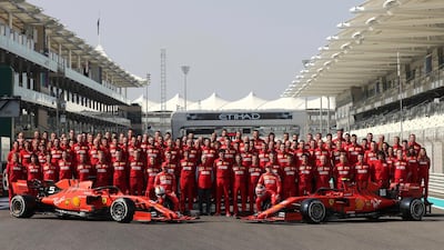Ferrari drivers Sebastian Vettel of Germany, left, and Charles Leclerc pose for an end season team picture on saturday. AP