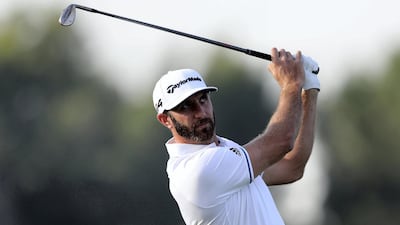 Dustin Johnson plays a shot.