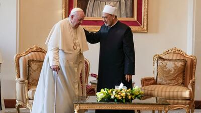 Pope Francis is greeted by Ahmed El-Tayeb, Grand Imam of al-Azhar, as he arrives for a meeting with the members of the Muslim Council of Elders at the Mosque of Sakhir Royal Palace, Bahrain. AP Photo