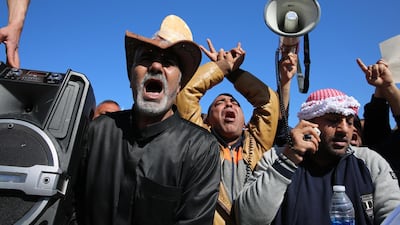 Jordanians shout slogans during a protest against government austerity measures in front of the parliament building in Amman on February 1, 2018. Amel Pain / EPA