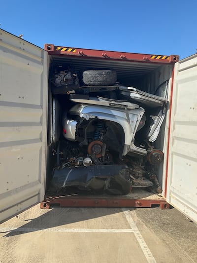Queensland Police said allegedly stolen vehicles were founded in shipping containers, hidden behind parts from dismantled cars. Photo: Queensland Police