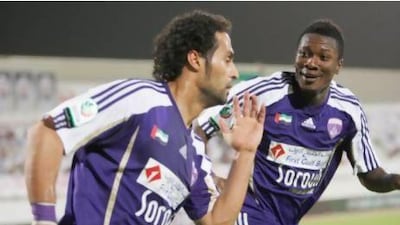 Yasser Al Qahtani, left, and Asamoah Gyan celebrate for Al Ain last season. Al Qahtani returned to Al Hilal at the end of the campaign. Mike Young / The National