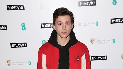 Tom Holland, in jeans, a black hoodie and Fila jacket, attends the EE InStyle Party in London on February 6, 2018. Getty Images