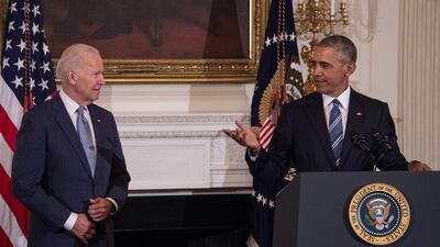 In this file photo taken on January 12, 2017, former US vice president Joe Biden wipes away tears as he walks past former President Barack Obama after he was awarded the Presidential Medal of Freedom during a tribute to Biden at the White House in Washington, DC. AFP