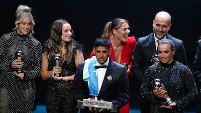 Back row, left to right, Alessa Russo, Ella Toone, Mary Earps and Pep Guardiola on stage with their trophies at the end of the show, during The Best Fifa Football Awards at the Eventim Apollo, London. PA
