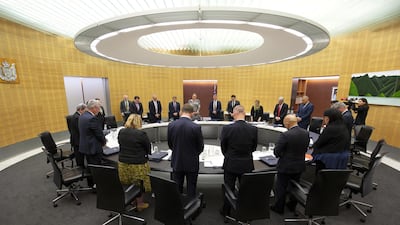 Members of the Cabinet observe a minute of silence for victims of the White Island tragedy during a cabinet meeting in Wellington, New Zealand. EPA