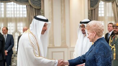 Dalia Grybauskait President of Lithuania, greets Khaldoon Al Mubarak, chief executive and managing director of Mubadala, chairman of the Abu Dhabi Executive Affairs Authority and Abu Dhabi Executive Council Member, during a reception at Mushrif Palace. Seen with Sheikh Mohammed bin Zayed, Crown Prince of Abu Dhabi and Deputy Supreme Commander of the Armed Forces. Rashed Al Mansoori / Crown Prince Court - Abu Dhabi