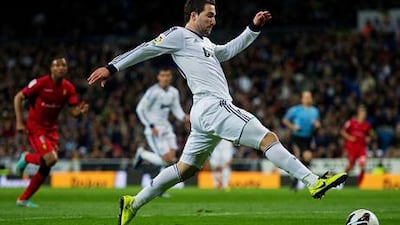 Real Madrid's Gonzalo Higuain guides the ball past the Real Mallorca defence.